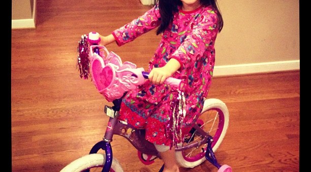 Clover on her Big Girl Princess Bike - we got her for her birthday as a surprise...